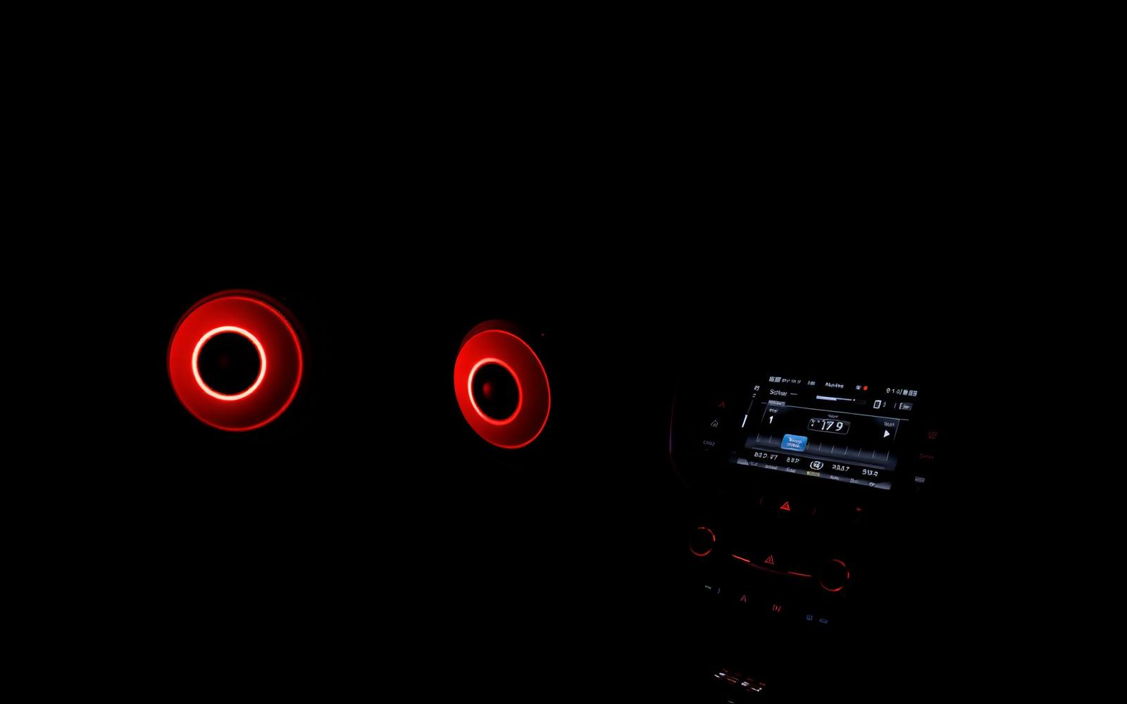 Red-lit car audio speakers and head unit